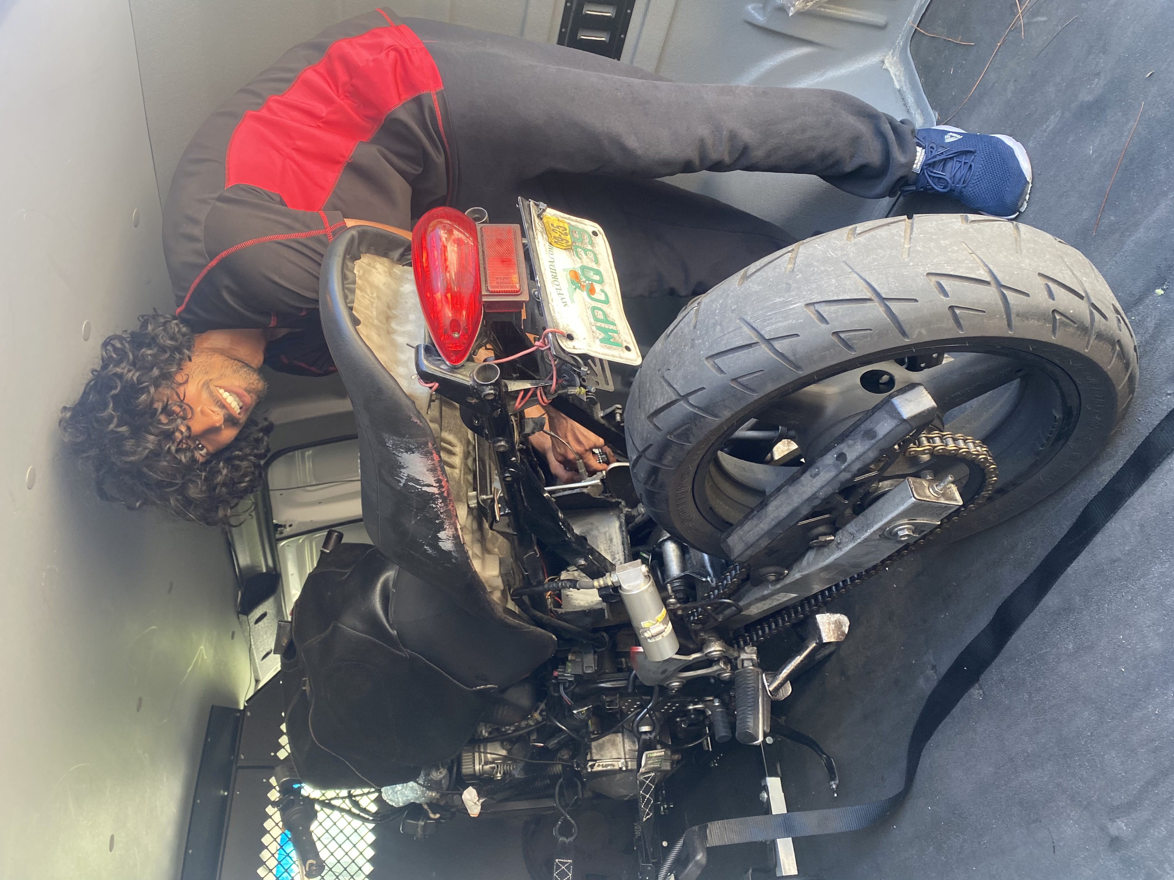 Enclosed motorcycle tow van transporting a sportbike near Daytona Beach, Florida