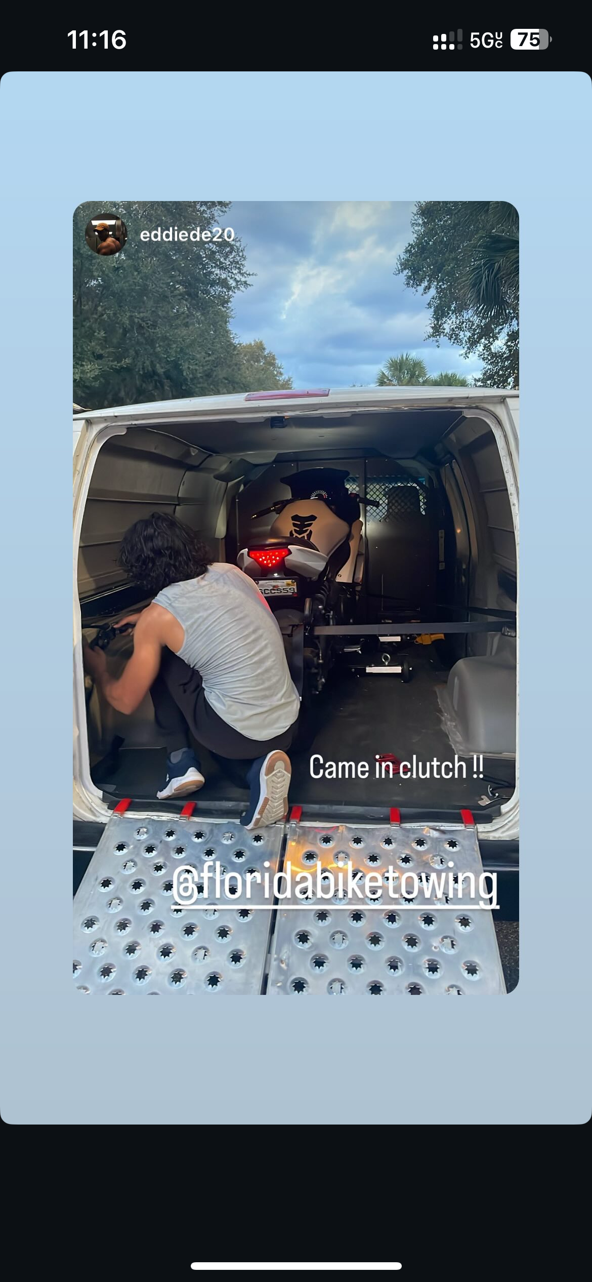 Cruiser motorcycle dropped off at a home garage after towing in Orlando